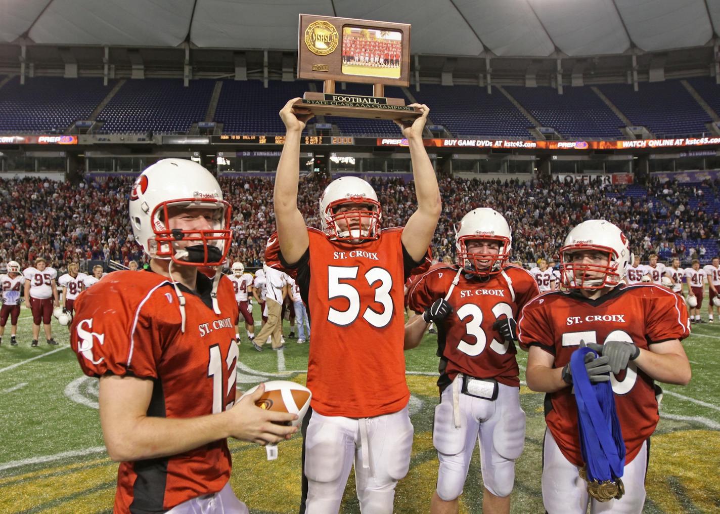 Fairmont vs. St. Croix Lutheran in Class 3A Championship game at the Dome, 11/26/11. (left to right) St. Croix Lutheran's Matt Olson, Braden Fischer, Jackson Goplen and Andrew Wyss celebrated their Class 3A championship over Fairmont.] Bruce Bisping/Star Tribune. bbisping@startribune.com Matt Olson, Braden Fischer, Jackson Goplen, Andrew Wyss/roster.