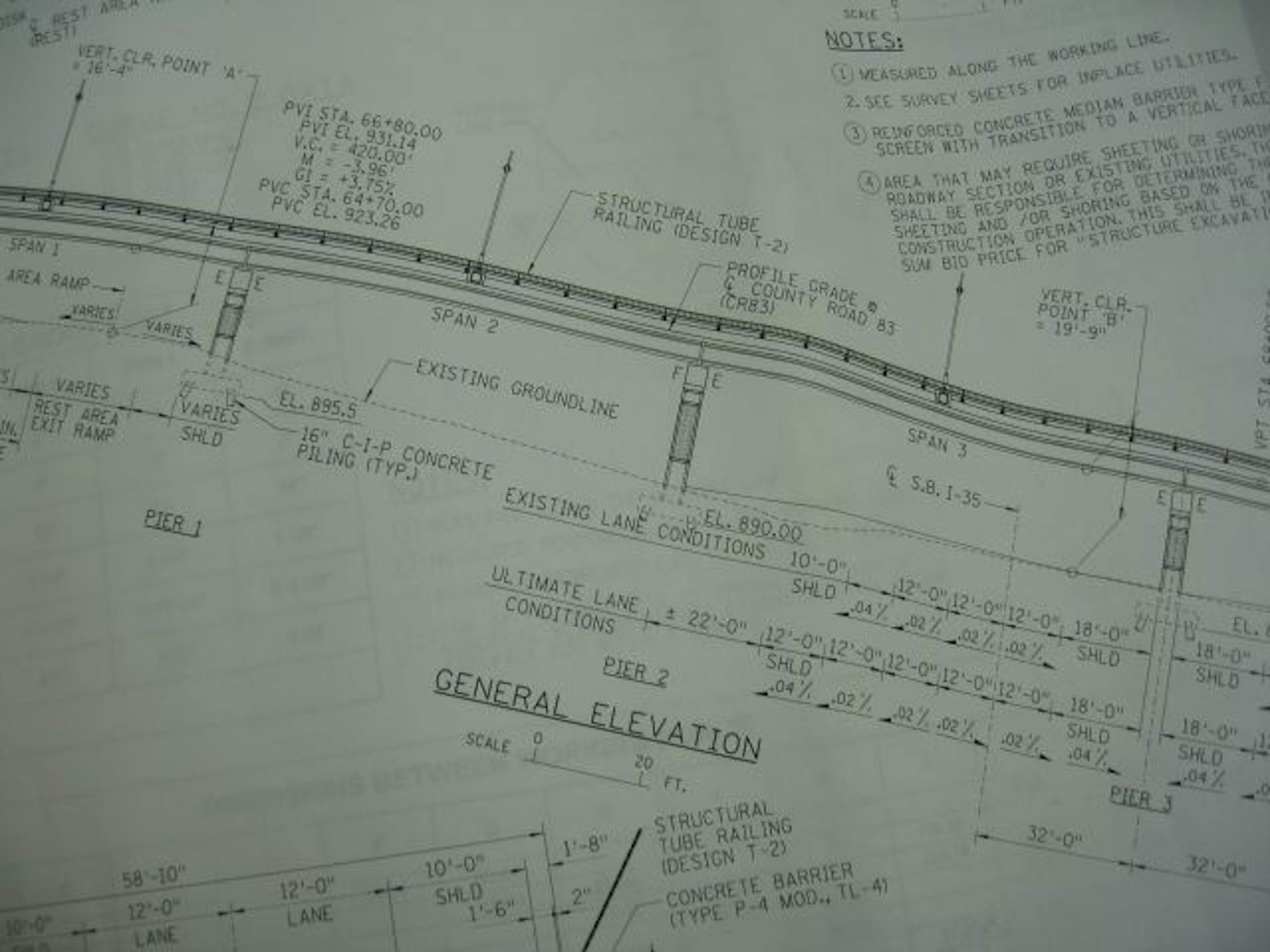 The county's Hwy. 83 overpass project, scheduled for completion in November, will reshape Forest Lake in big ways. Right now residents have to cross Interstate 35 on the Broadway Avenue bottleneck, causing even more congestion in a city already fractured by pockets of growth. Residents speak of the new bridge with excitement. In this photo: Blueprints for the contractor's shack.