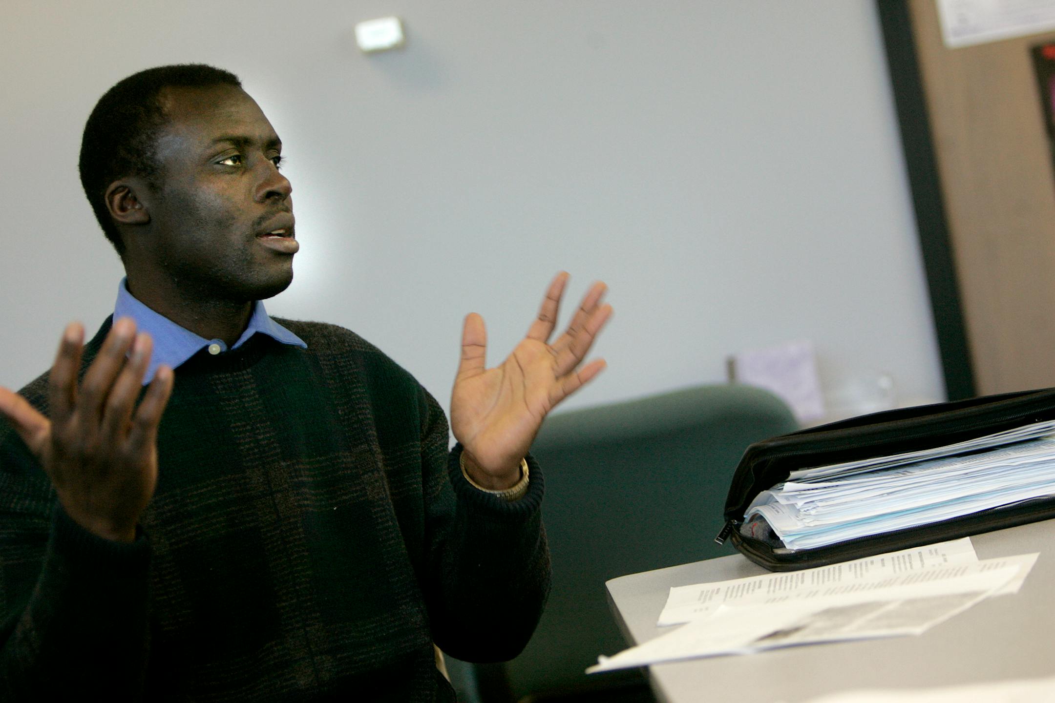 The Rev. Jonathan Awasom, 37, was at the Minnesota WorkForce Center Tuesday seeking help in finding a job. Awasom, who has a master's degree in religion and theology, is seeking a faith-based job.