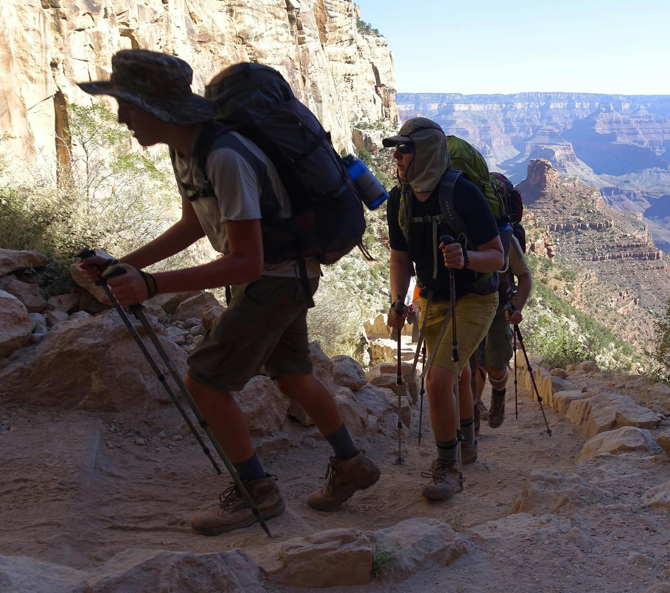 FILE - In this July 27, 2015, file photo, a long line of hikers head out of the Grand Canyon along the Bright Angel Trail at Grand Canyon National Park, Ariz. The National Park Service is floating a proposal to increase entrance fees at 17 of its most popular sites next year. (AP Photo/Ross D. Franklin, File)