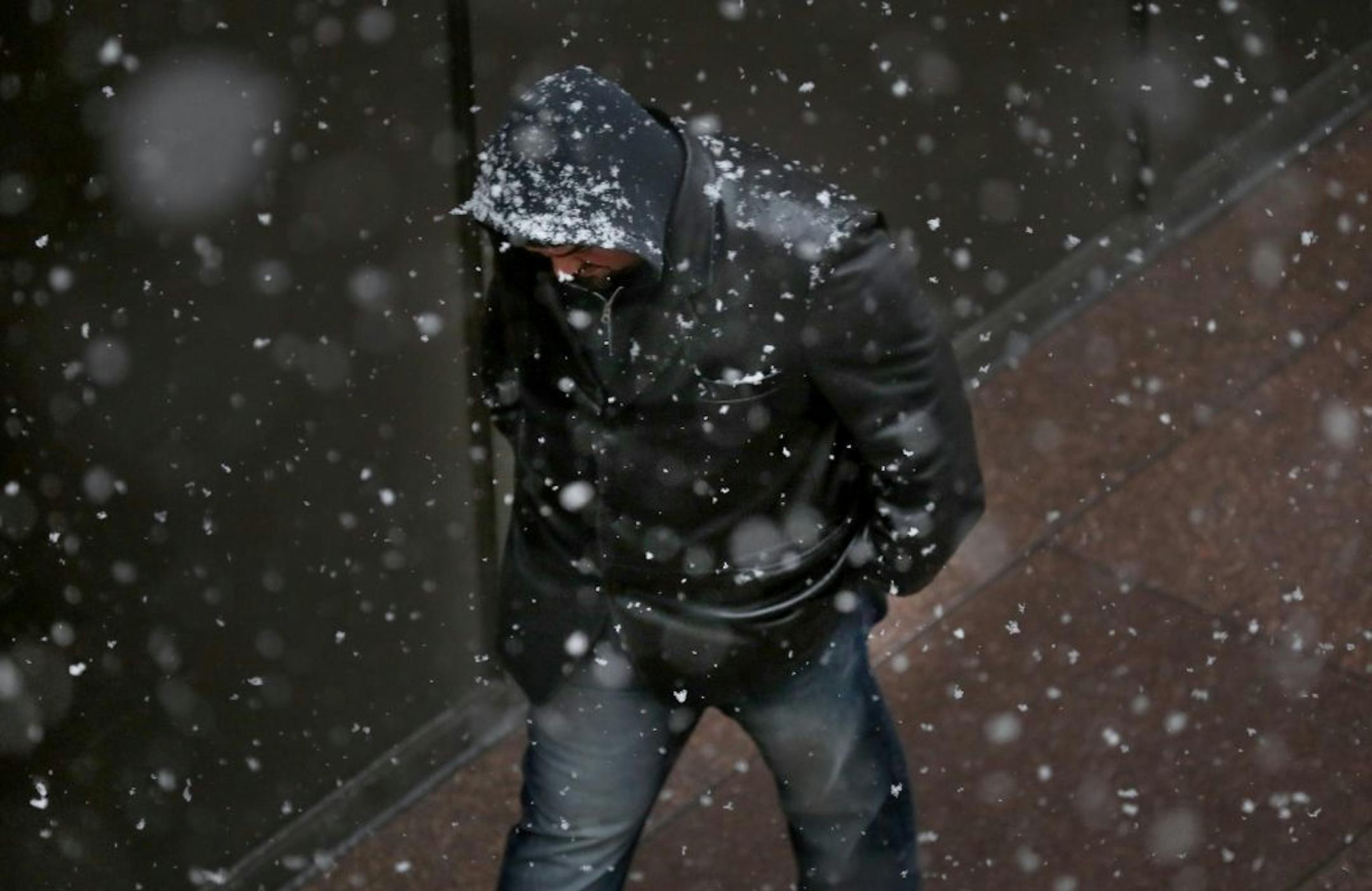 A man makes his way through the snow along 6th St. S. near 2nd Ave. S. Friday, Nov. 3, 2017, in Minneapolis, MN.