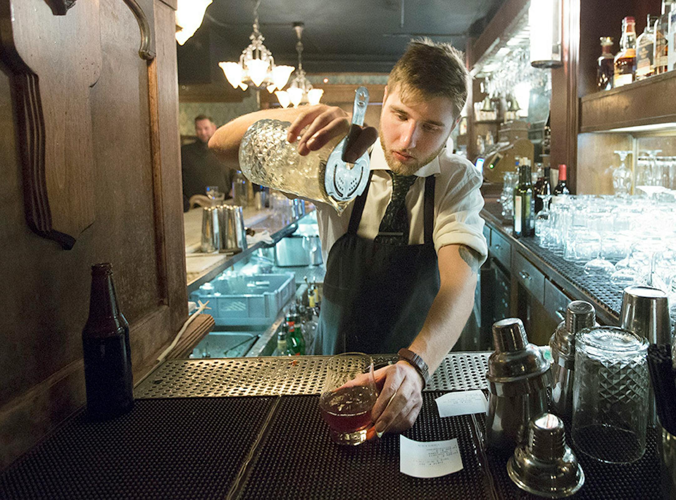 Bartender Sam Berkland made a drink at Volstead's Emporium in Uptown.
