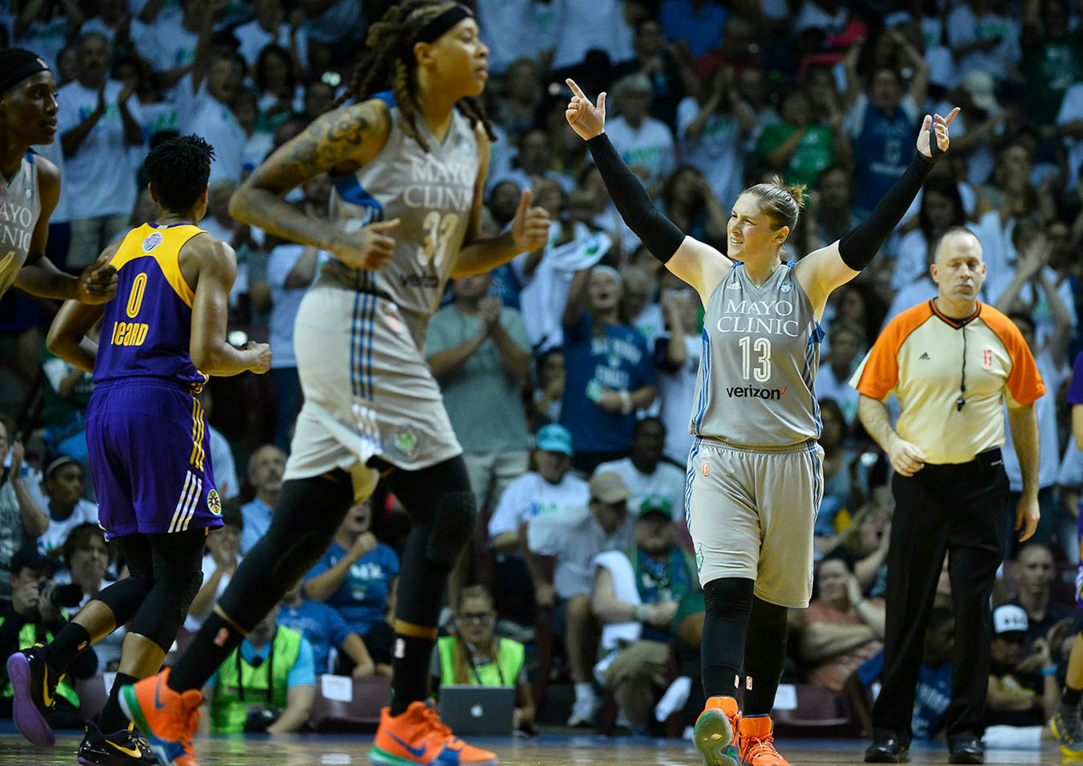 Minnesota Lynx guard Lindsay Whalen (13) celebrated after a quick five points scored by guard Jia Perkins led to a timeout early in the third quarter.