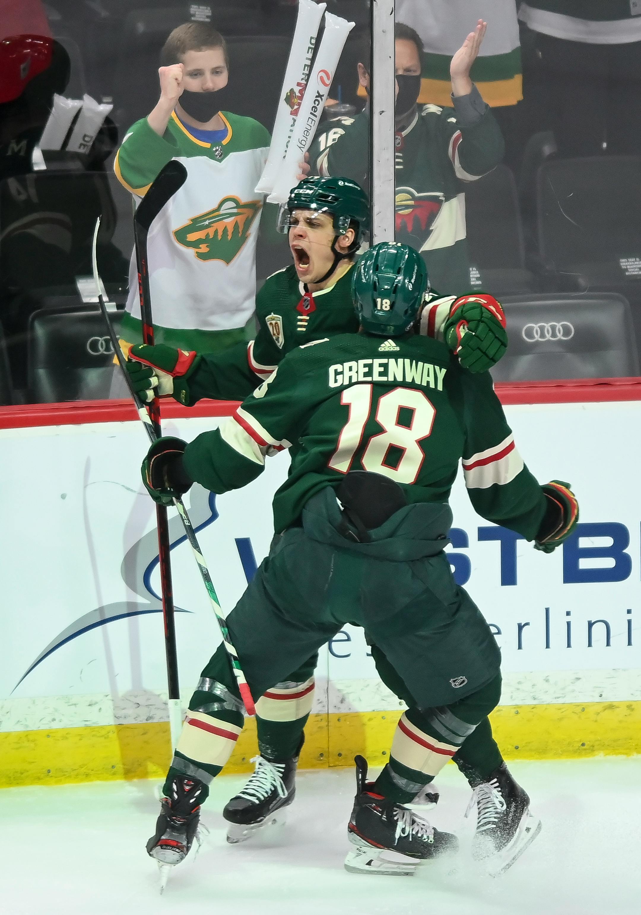 Minnesota Wild center Joel Eriksson Ek (14) and left wing Jordan Greenway (18) celebrated Eriksson Ek's goal in the first period against the Vegas Golden Knights.