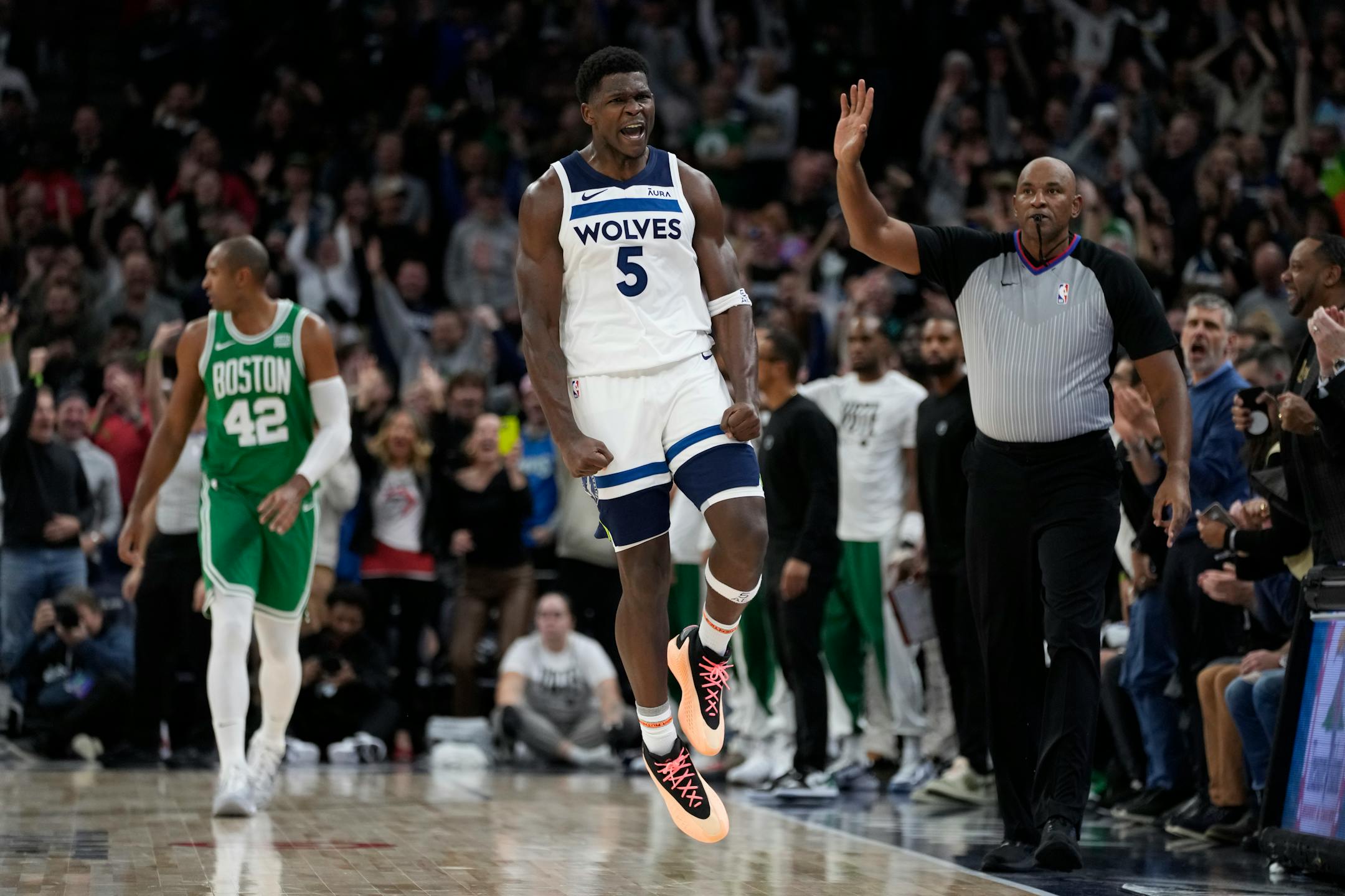 Minnesota Timberwolves guard Anthony Edwards (5) celebrates after making a shot during overtime of an NBA basketball game against the Boston Celtics, Monday, Nov. 6, 2023, in Minneapolis. (AP Photo/Abbie Parr)