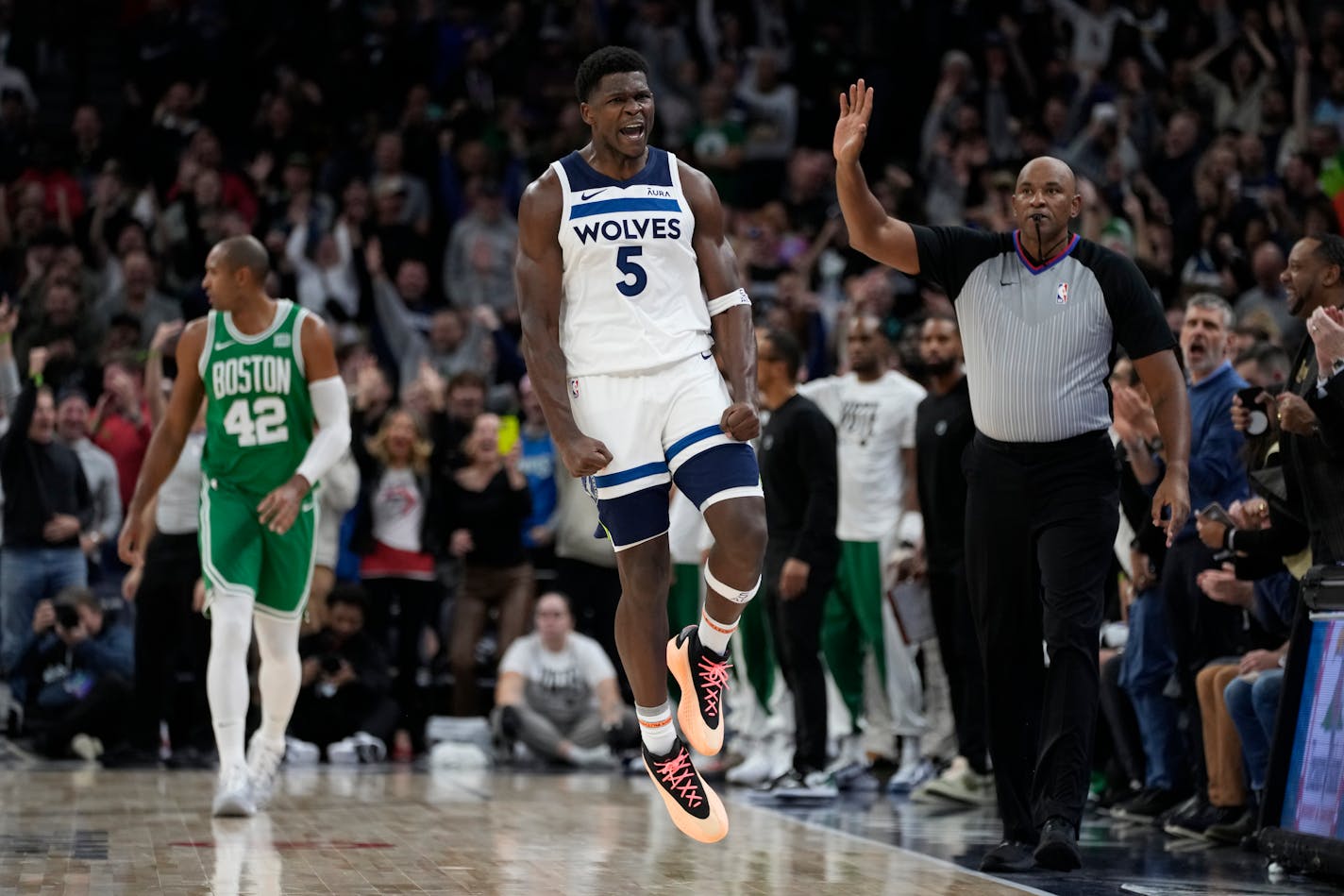 Minnesota Timberwolves guard Anthony Edwards (5) celebrates after making a shot during overtime of an NBA basketball game against the Boston Celtics, Monday, Nov. 6, 2023, in Minneapolis. (AP Photo/Abbie Parr)