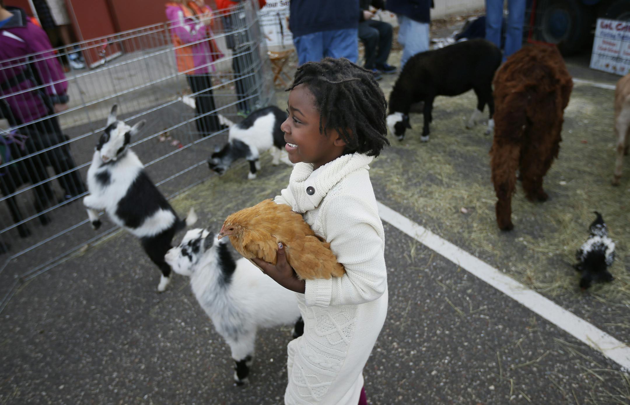 Honesty, 5, who was recently adopted, posed for a photo for her mom Jessi, during the 16th annual Celebrate Adoption event held by the Minnesota Department of Human Services Sunday in Oakdale.