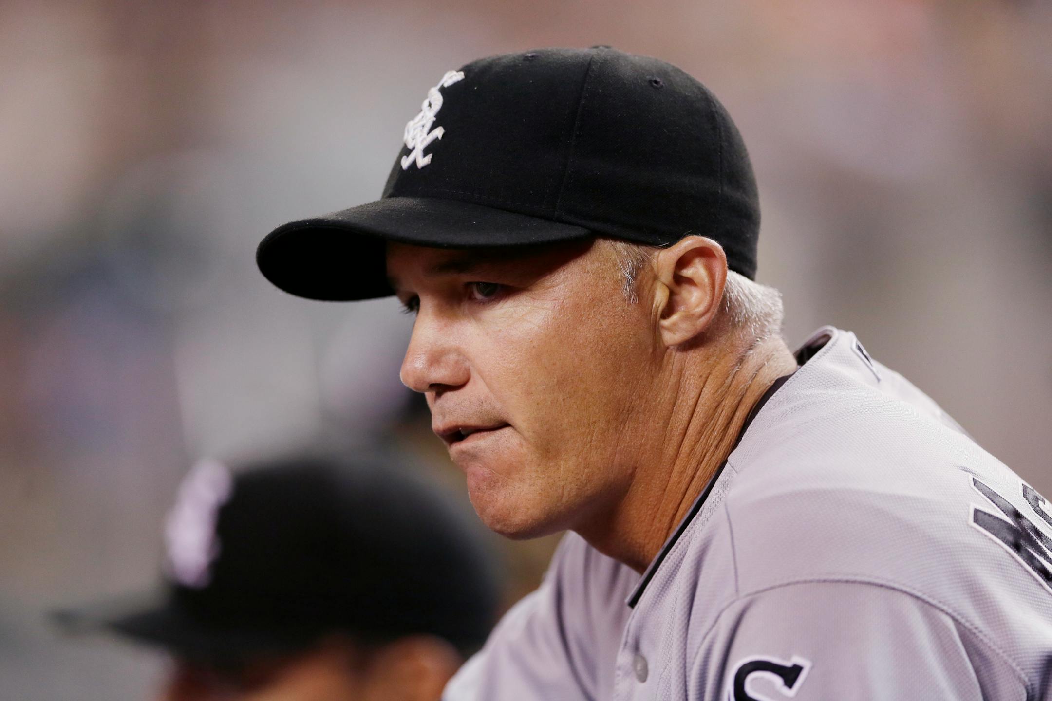 Chicago White Sox third base coach Joe McEwing is seen in the dugout during the seventh inning of a baseball game against the Detroit Tigers, Wednesday, July 30, 2014 in Detroit. (AP Photo/Carlos Osorio) ORG XMIT: otkco135