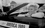 September 11, 1988 JOHN CROFT - Miss America, Gretchen Carlson of Anoka, Minn. poses in the front seat of a car she gets to use during her reign The p