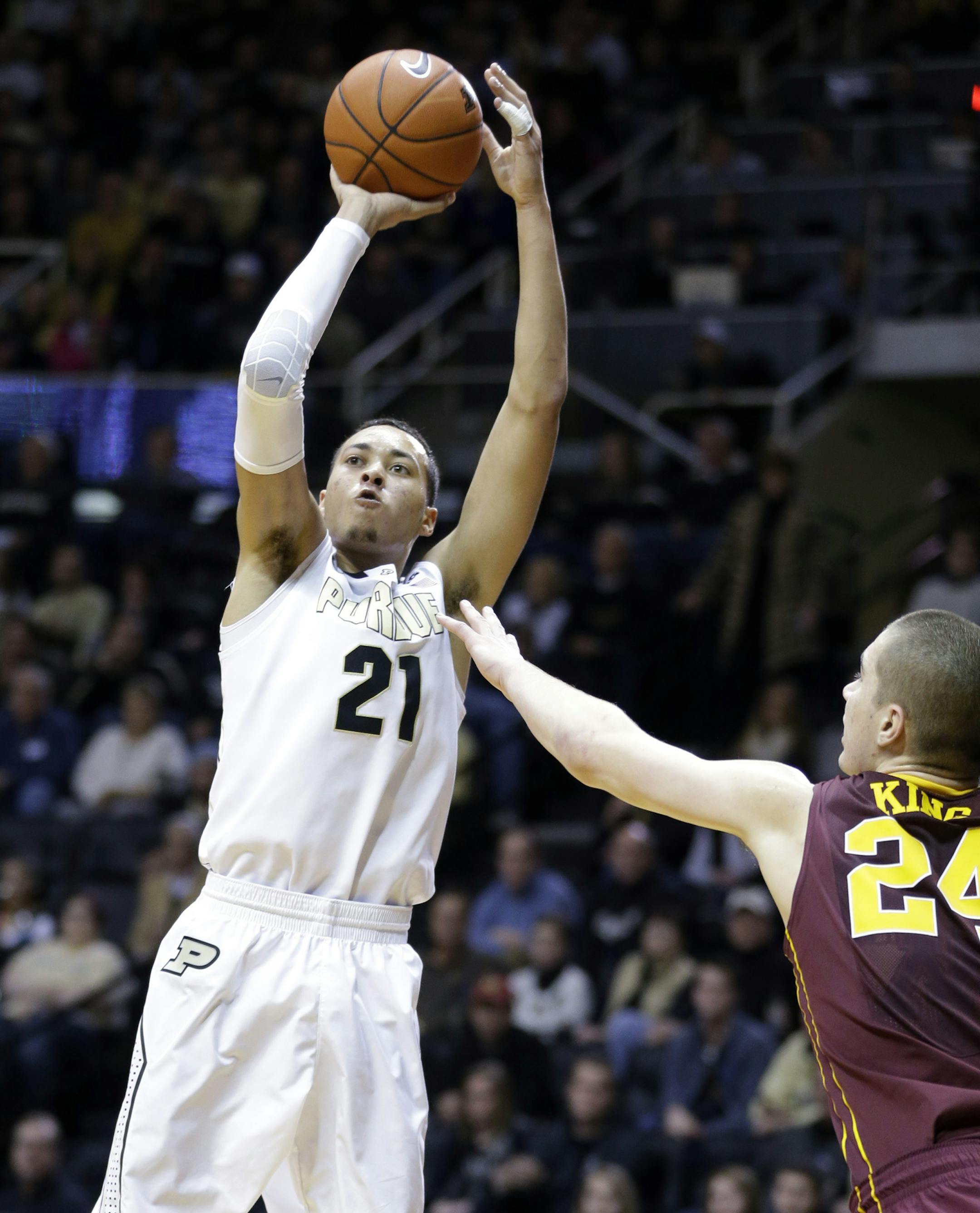 Purdue guard Kendall Stephens (21) shoots over Minnesota forward Joey King (24) in the second half of an NCAA college basketball game in West Lafayette, Ind., Wednesday, Dec. 31, 2014. Purdue defeated Minnesota 72-68. (AP Photo/Michael Conroy)
