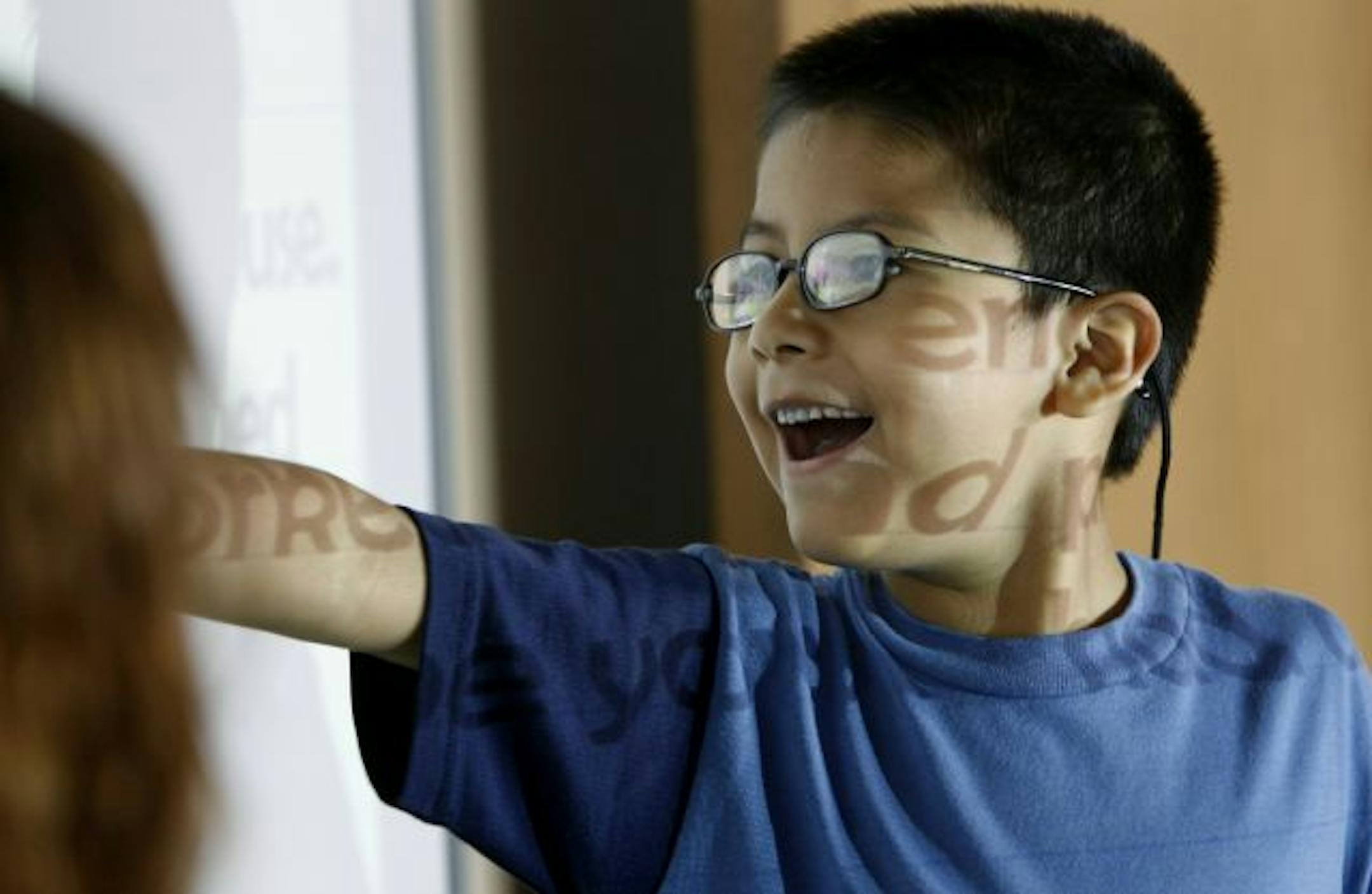 First-grader Yahir Sanchez-Araujo was enthusiastic about a school assignment at the Metro Deaf School. The Metro Deaf School was only the state's second charter school when it opened in 1993. This week it and Minnesota North Star Academy become the first two charter schools to merge. They are the only two charter schools for deaf children.