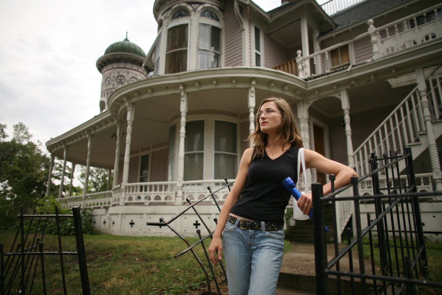 Realtor Connie Nompelis outside the Bardwell-Ferrant House on Wednesday afternoon. Preservationists are rallying to save the historic property at 2500 Portland Avenue S. in Minneapolis before vandals can do any more damage to its restored architectural details.