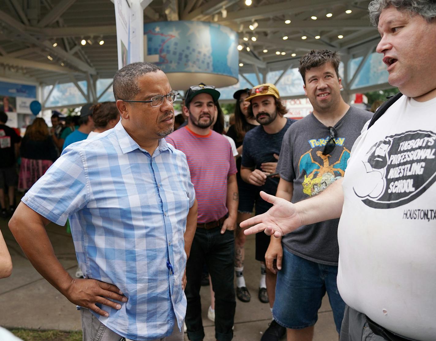 U.S. Rep. Keith Ellison, who's running for state attorney general, spoke with fairgoers outside the DLF booth Saturday. ] ANTHONY SOUFFLE &#xef; anthony.souffle@startribune.com U.S. Rep. Keith Ellison, who's running for state attorney general, spoke with fairgoers Saturday, Aug. 25, 2018 in the DFL booth at the Minnesota State Fair in St. Paul, Minn.