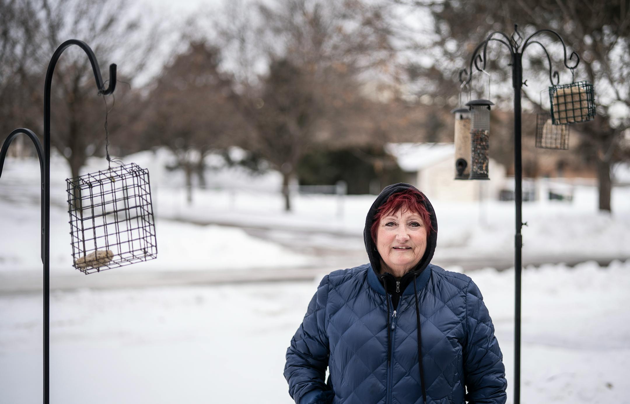 Barbara Gusse poses for a photo at her home on Sunday Feb. 7, 2021, in Brooklyn Center, Minn. Gusse spotted a stolen SUV that triggered an Amber Alert on Saturday afternoon, Feb. 6 leading police to the abandoned vehicle and the crying toddler inside. (Jerry Holt/Star Tribune via AP)