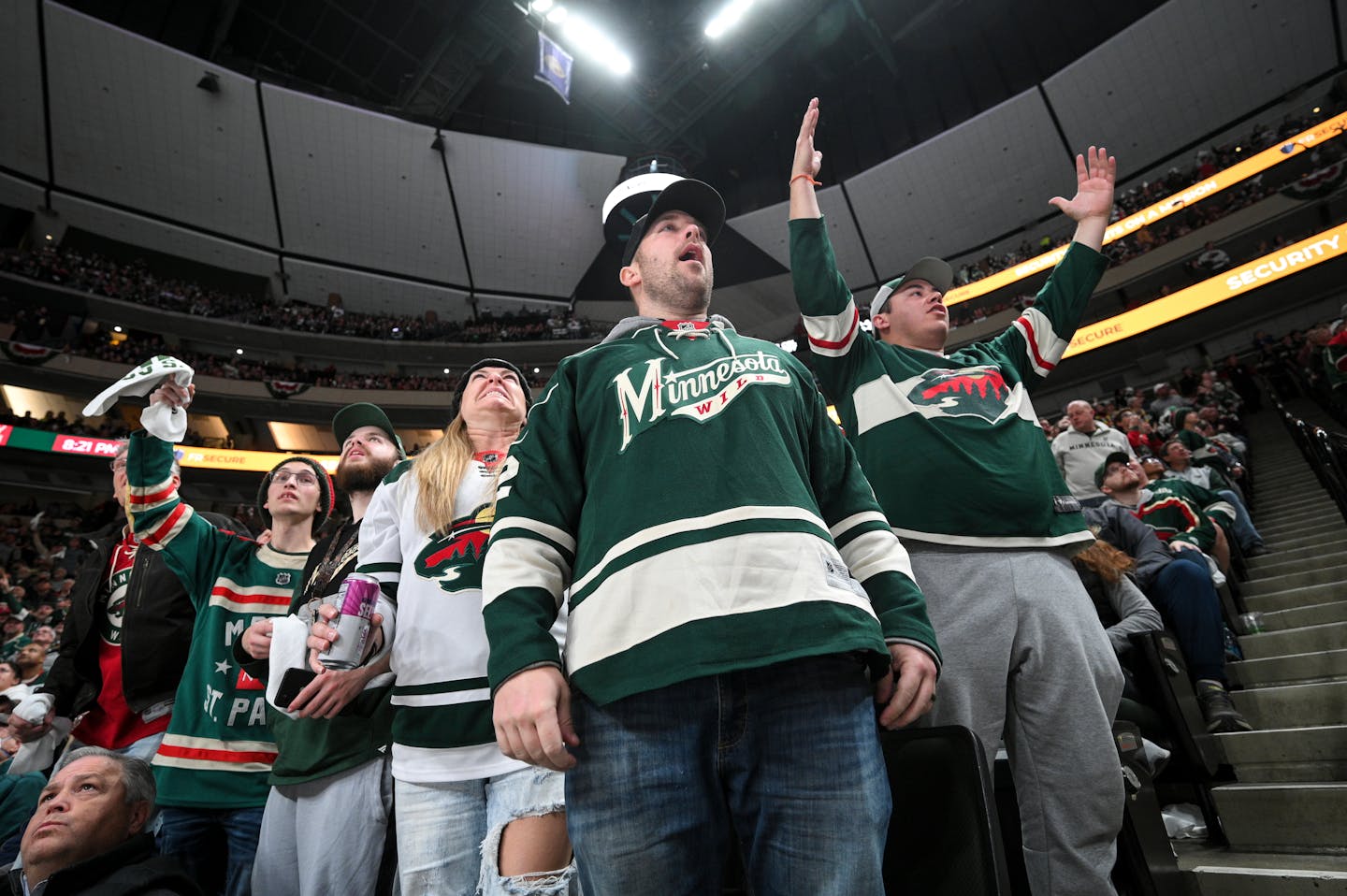 Minnesota Wild fans, including Kris Fay, center and his wife Katie, of Albany, Minn., are upset with officials during the second period against the New York Rangers Thursday, Oct. 13, 2022 at the Xcel Energy Center in St. Paul, Minn.. ] aaron.lavinsky@startribune.com