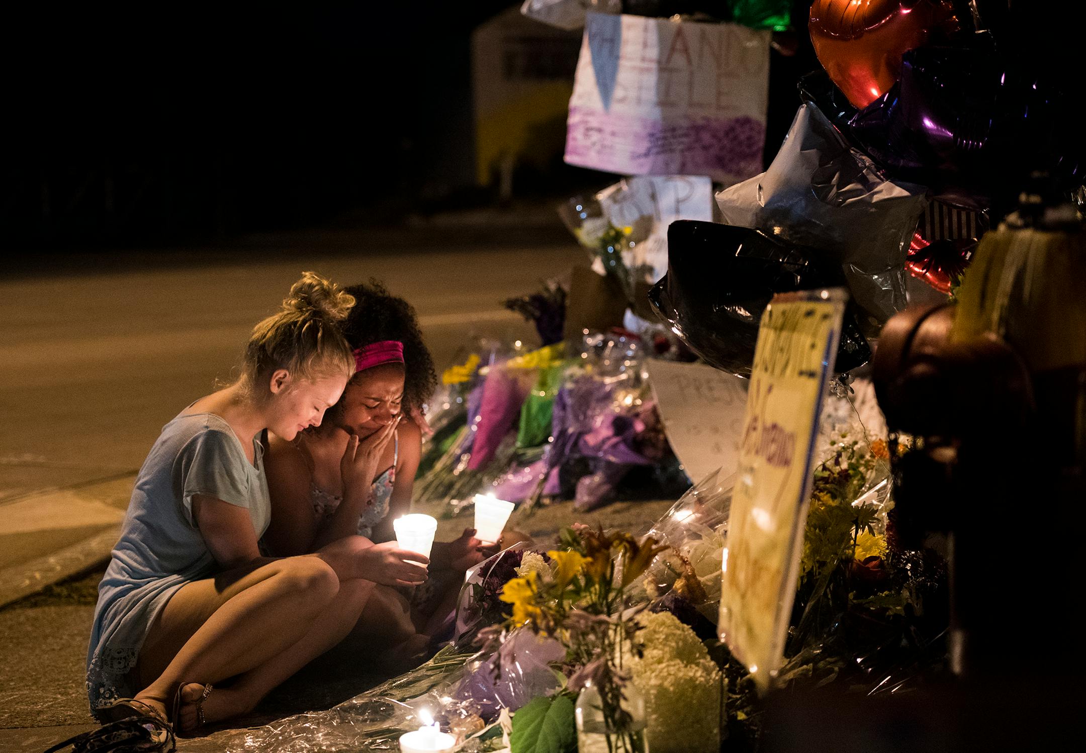 Visitors at a roadside memorial in July near where Philando Castile was shot and killed by a police officer. The officer, Jeronimo Yanez of the St. Anthony Police Department, faces three felony counts in connection with the incident — second-degree manslaughter and two counts of dangerous discharge of a firearm.