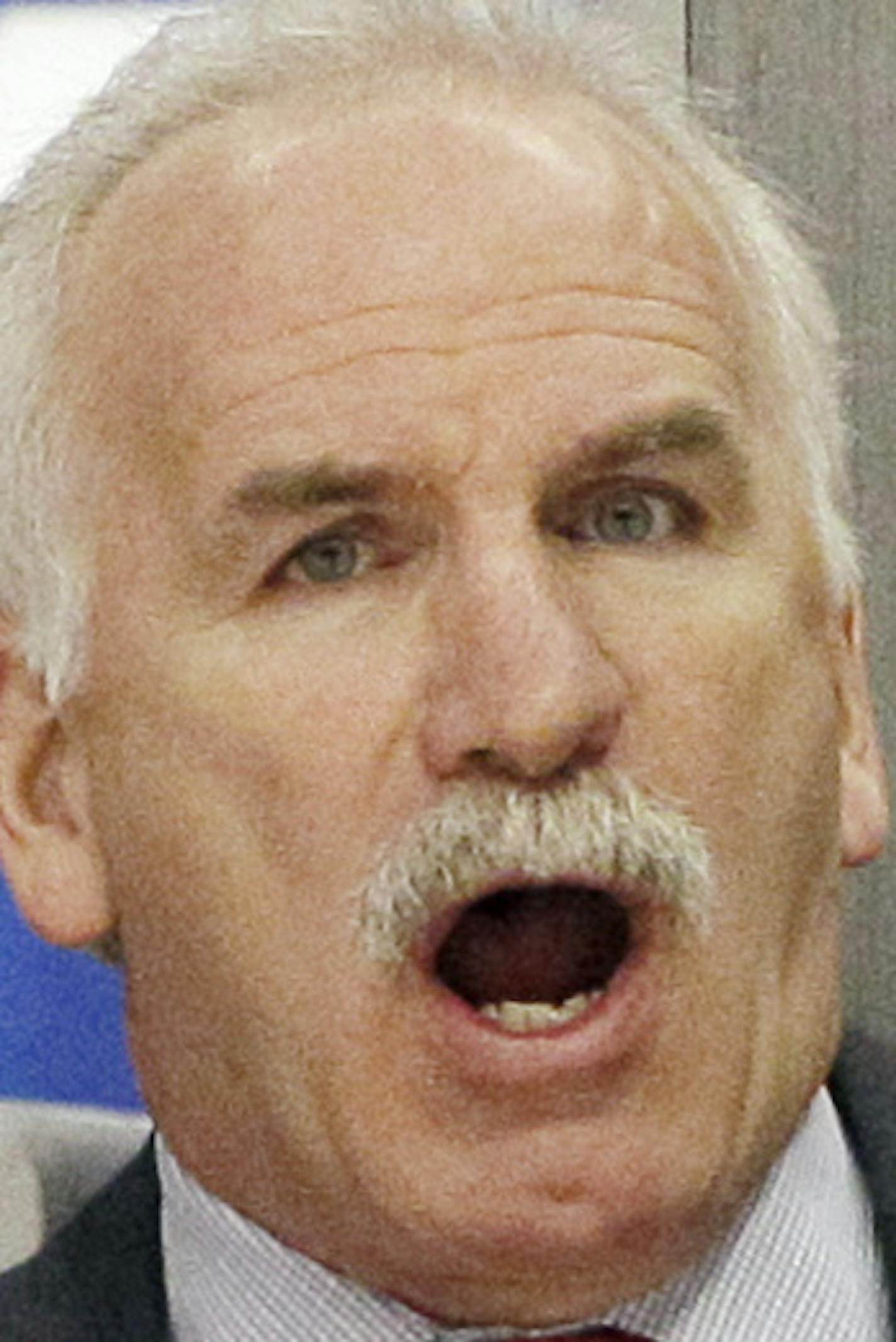 Chicago Blackhawks coach Joel Quenneville yells to his team during the first period of an NHL hockey game against the St. Louis Blues in Chicago, Thursday, March 29, 2012. (AP Photo/Nam Y. Huh) ORG XMIT: MIN2013042919240470