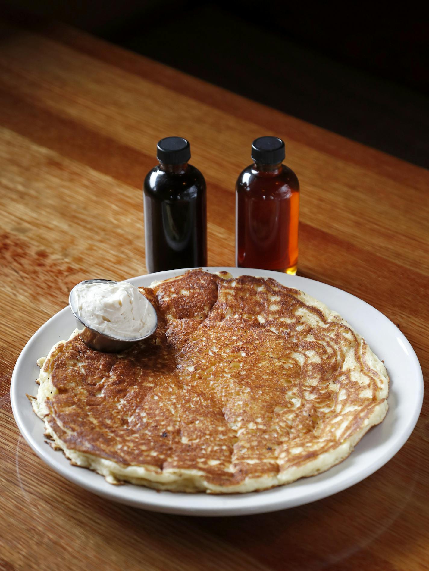 A plate sized Buttermilk Pancake with Chester creek homemade Oatmeal stout beer syrup and Rogotzke maple syrup from At Sara's Table / Chester Creek Cafe in Duluth. ] CARLOS GONZALEZ cgonzalez@startribune.com - June 4, 2016, Duluth, MN, Taste Section Story Food, Coffee, Drinks, Bars and Restaurants of the Duluth Area