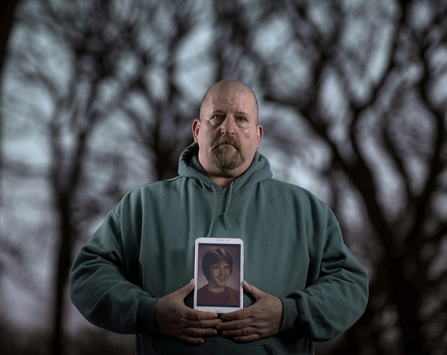 "First there was the sex abuse. Then years of coverup. Then the archdiocese fought against us in the Legislature. Now it's three years with no settlement. What kind of message does that send?" said David Lind, with a photo of himself at 14.