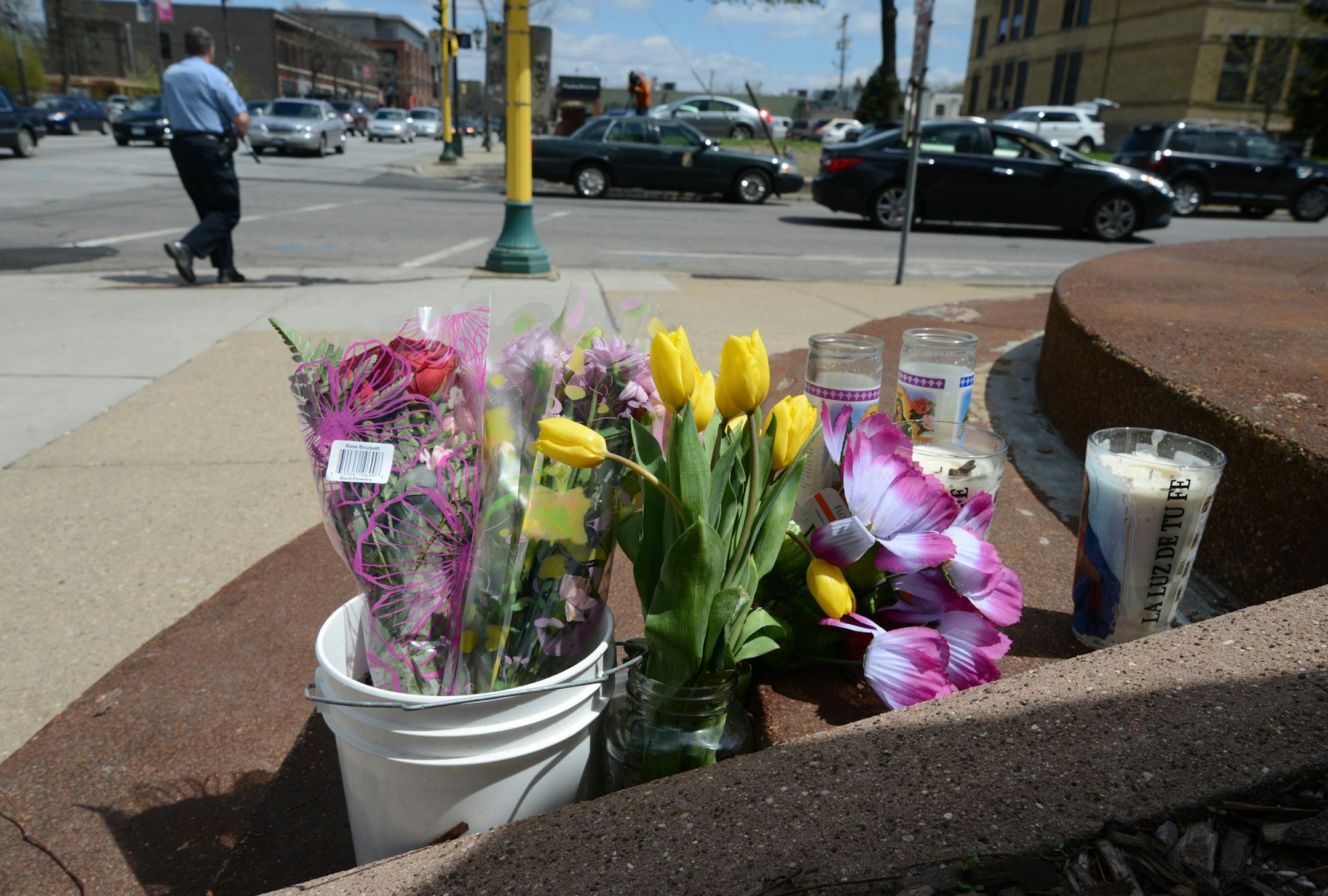 The driver of the motorcycle, Ivan Romero Oliveras, was killed during crash with a police squad at the intersection of 26th Street and Blaisdell Avenue. His passenger, Joselin Torrejon, was injured and is listed as serious at HCMC. Friends and family left flowers and lit candles at crash scene.