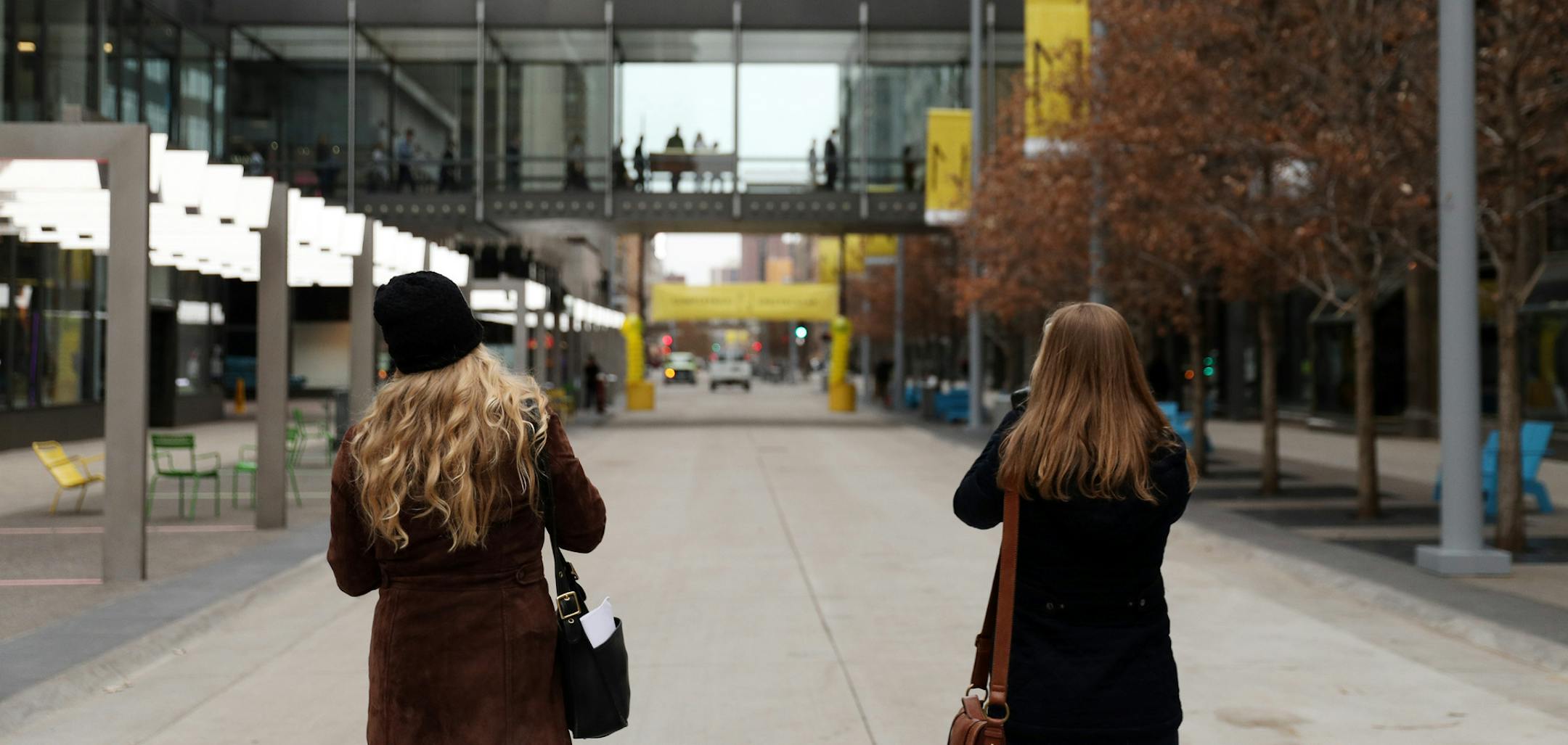 Two women stopped to photograph the empty street following dedication ceremony to mark the opening of the newly renovated Nicollet Mall Thursday. ] ANTHONY SOUFFLE ï anthony.souffle@startribune.com Mayor Betsy Hodges, Steve Cramer and others spoke during a ceremony to mark the reopening of Nicollet Mall Thursday, Nov. 16, 2017 in downtown Minneapolis.