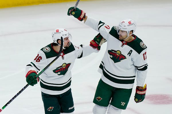 Wild winger Marcus Foligno, right, celebrated with Mats Zuccarello after scoring in Minnesota’s 5-1 road victory over Chicago on Jan. 21.