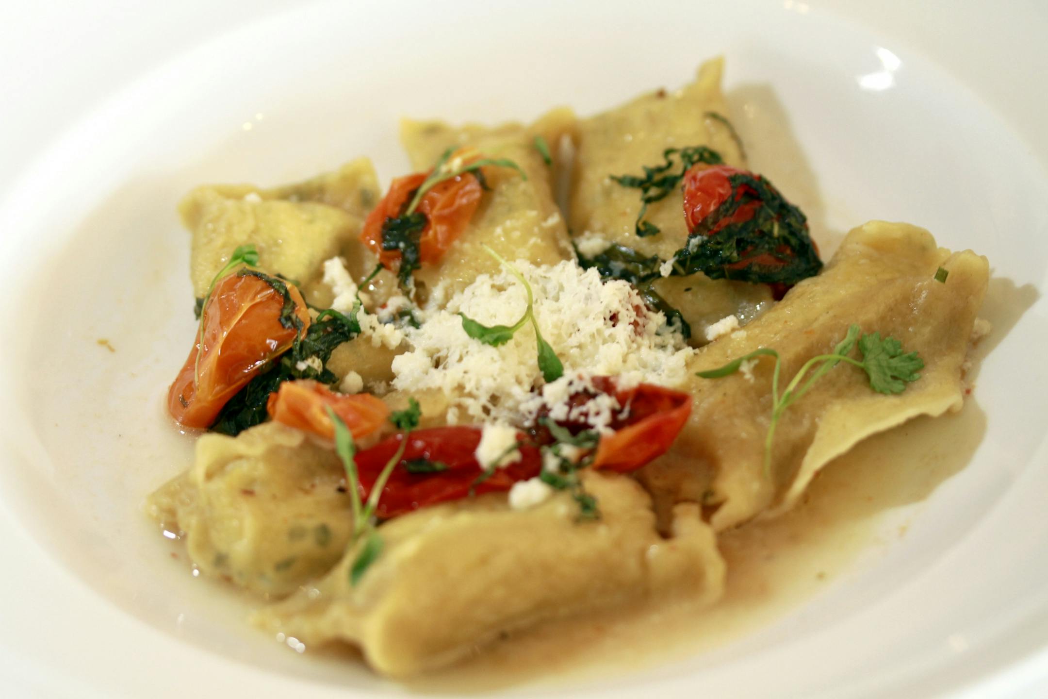 Restaurant review, - Lela, - RICOTTA AGNOLOTTI Basilico, Cured Tomatoes, Parmesan Brodo