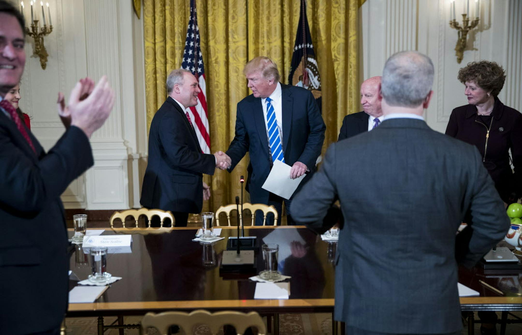 President Donald Trump shakes hands with Rep. Steve Scalise (R-La.), the majority whip, during a meeting regarding the proposed American Health Care Act, at the White House in Washington, March 7, 2017. The White House appears increasingly confident about the bill’s prospects in the House; Trump expects more trouble in the Senate. (Doug Mills/The New York Times)