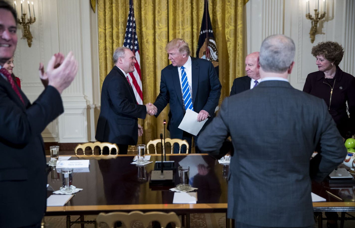 President Donald Trump shakes hands with Rep. Steve Scalise (R-La.), the majority whip, during a meeting regarding the proposed American Health Care Act, at the White House in Washington, March 7, 2017. The White House appears increasingly confident about the bill&#x2019;s prospects in the House; Trump expects more trouble in the Senate. (Doug Mills/The New York Times)