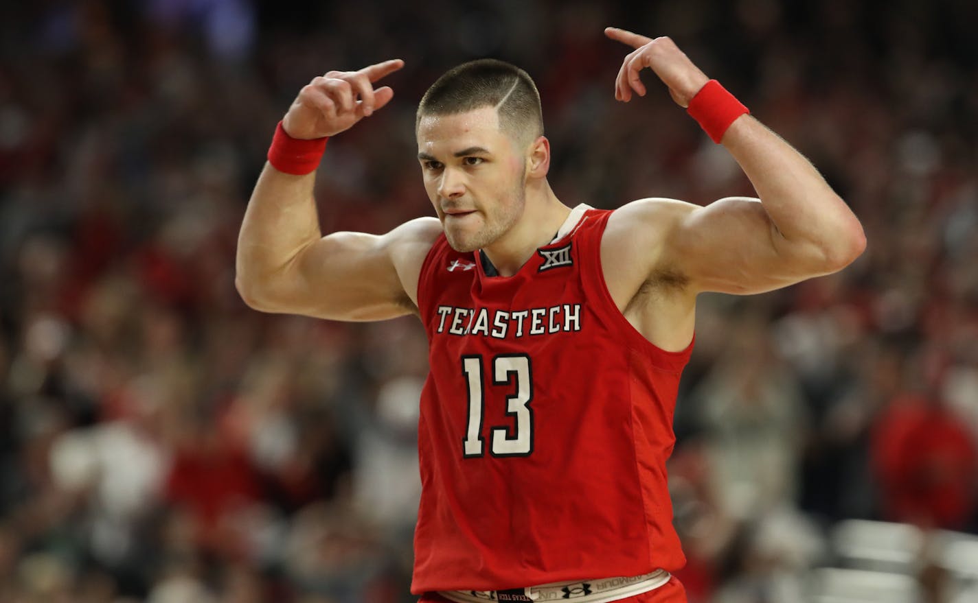 Texas Tech guard Matt Mooney reacted after one of his four three-pointers Saturday night. Mooney's 22 points sent the Red Raiders into the national championship game for the first time in program history.