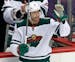 Minnesota Wild's Matt Cullen (7) acknowledges fans after a tribute to his time with the Pittsburgh Penguins during a timeout in the first period of an