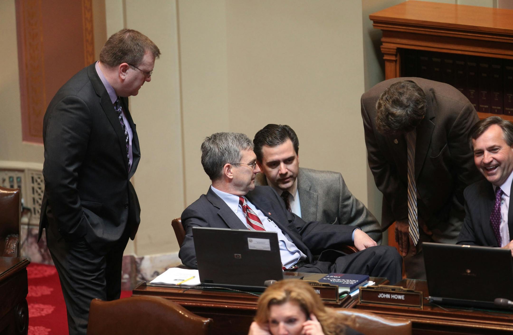 Sen. David Hann and Sen. Sean Nienow, seated at center