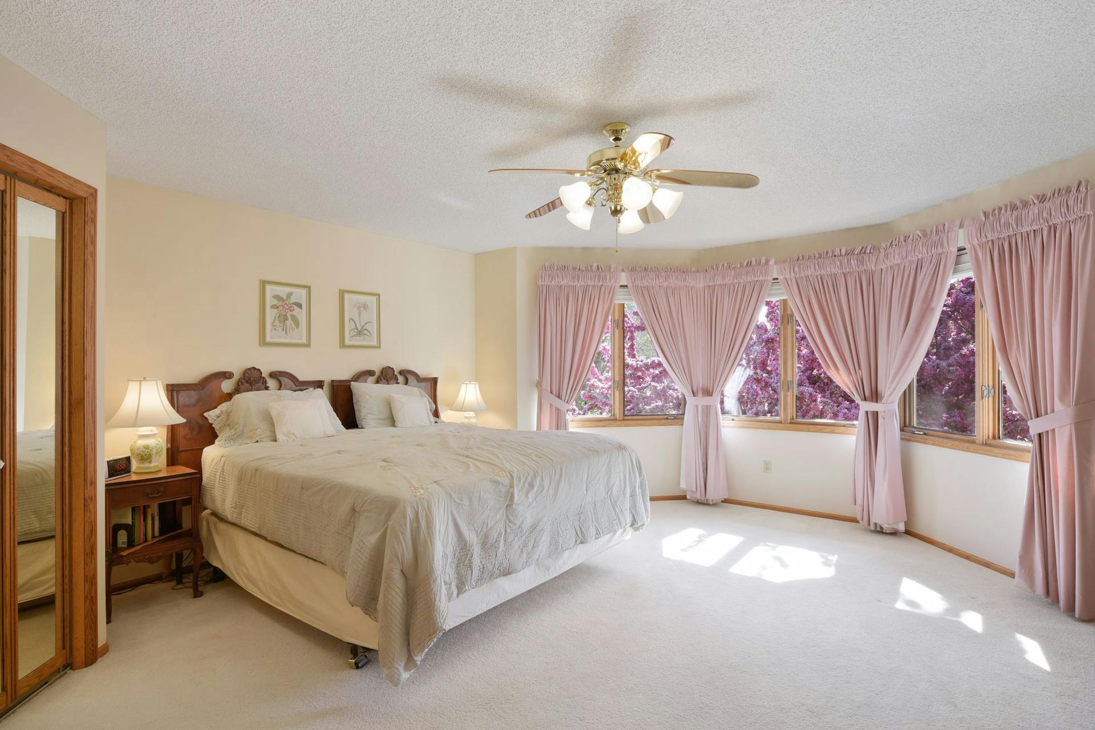 The master bedroom includes original custom-made mauve curtains with the inscription "Puckett" on each one.
