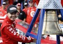 Kyle Larson rings the El Camino Real bell after his win in the NASCAR Cup Series auto race at Auto Club Speedway in Fontana, Calif., Sunday, March 26,