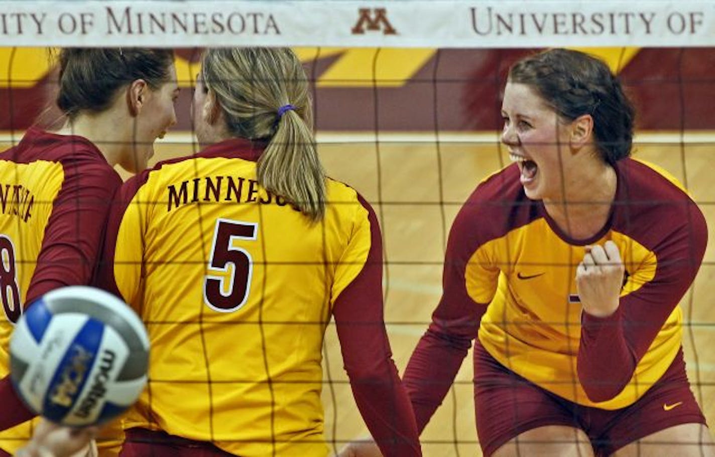 Gophers including Mia Tabberson, right celebrated after winning game two.