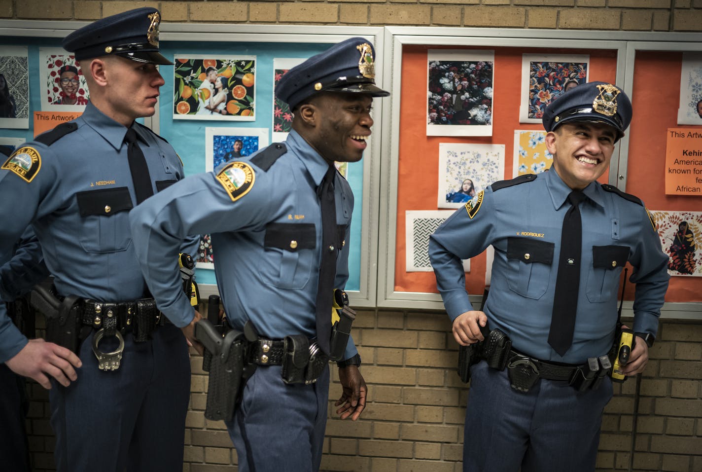 Victor Rodriquez, 25, who overcame serious socioeconomic obstacles and a troubled youth to join St. Paul's Law Enforcement Career Path Academy, becomes the first in his family to earn a higher ed degree. on the far left is graduate Joshua Needham and Stephen Nuah.] St. Paul police will graduate its most diverse recruiting class ever Thursday night at Harding H.S. The class of 39 SPPD recruits is 77% people of color.RICHARD TSONG-TAATARII &#xa5; richard.tsong-taatarii@startribune.com