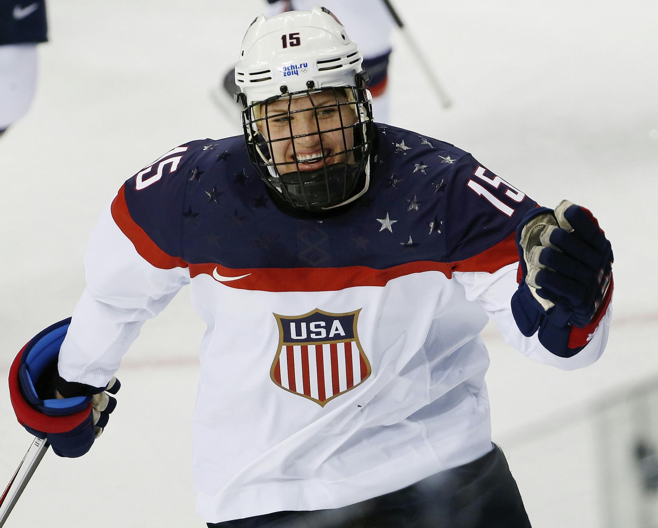 Anne Schleper of the United States celebrates a goal against Canada during the second period of the 2014 Winter Olympics women's ice hockey game at Shayba Arena, Wednesday, Feb. 12, 2014, in Sochi, Russia. (AP Photo/Petr David Josek)