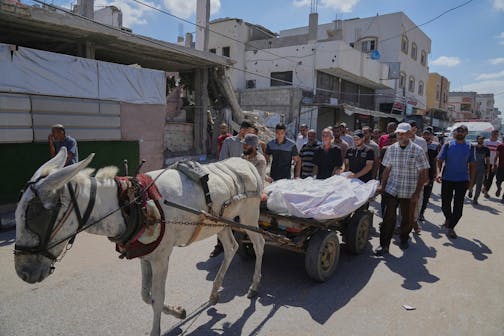 Mourners attend the funeral of relatives killed in an Israeli bombardment, in Deir al-Balah, central Gaza Strip, on July 31, 2025.