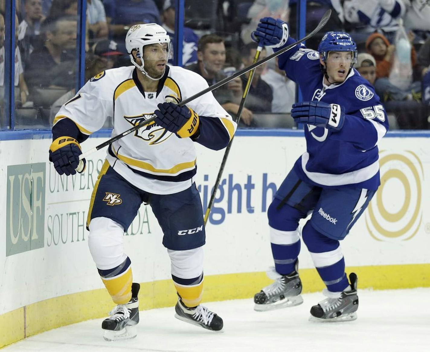 Nashville Predators center Matt Cullen and Tampa Bay Lightning defenseman Matt Taormina (55) look up ice during the first period of an NHL preseason hockey game Thursday, Sept. 19, 2013, in Tampa, Fla. (AP Photo/Chris O'Meara) ORG XMIT: MIN2013100422195321