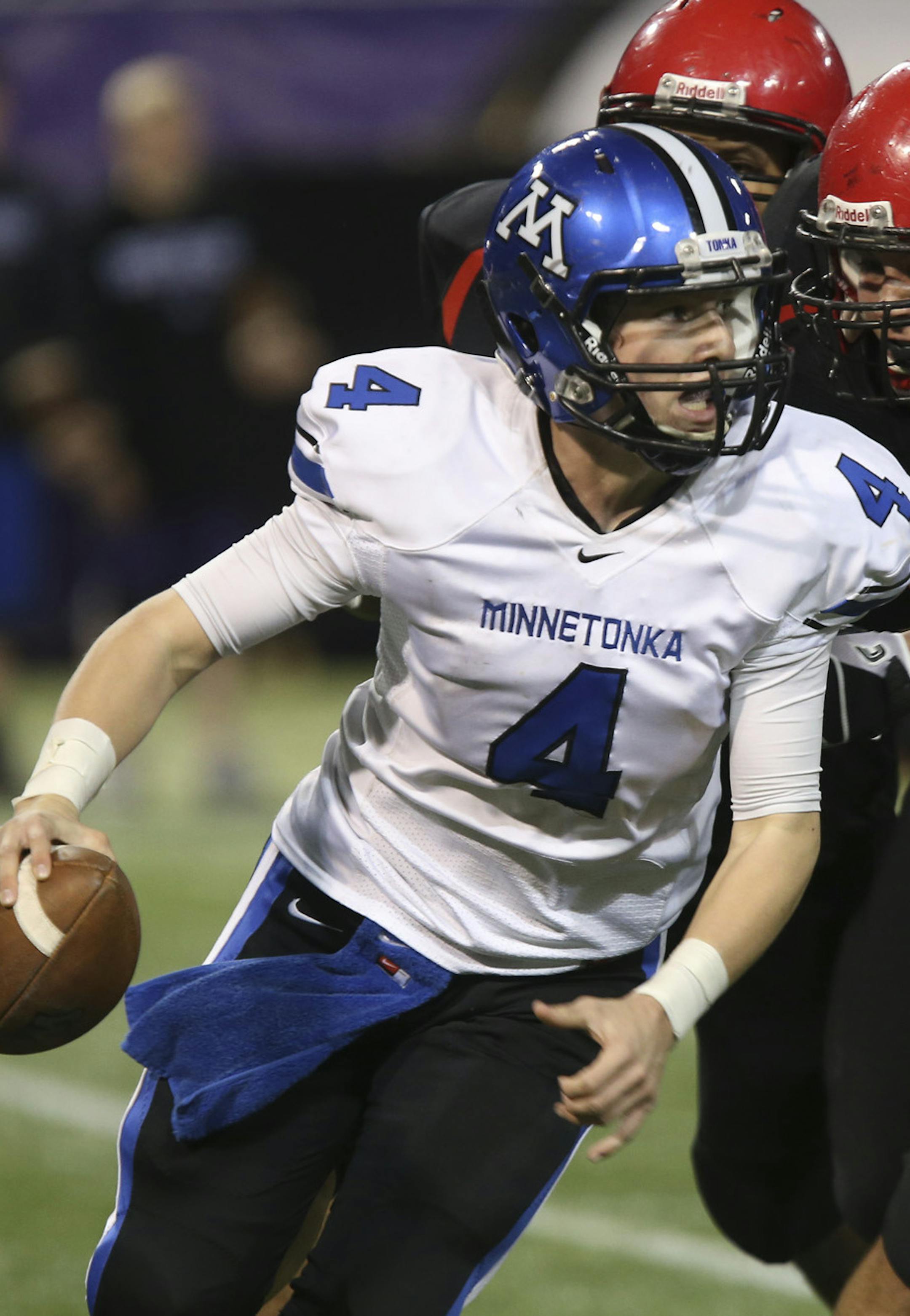 Minnetonka's quarterback Nick Rooney ran from the Eden Prairie defense during the fourth quarter of the class 6A quarterfinals at Mall of America Field in Minneapolis, Min., Friday November 9, 2012. Eden Prairie won 21-18. ] (KYNDELL HARKNESS/STAR TRIBUNE) kyndell.harkness@startribune.com ORG XMIT: MIN1211092250409005