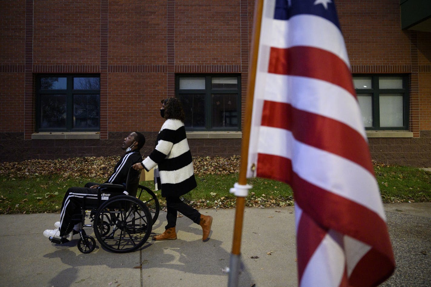 Roxanne Mckinney pushed her son, Quentin, after he cast his ballot at Lucy Laney community school Tuesday. "Our country has to make sure to take care of the disabled," said Quentin, who says he's measurably impaired with multiple sclerosis. His mother said she voted early. "I just don't know how we're going to come back from this," said Roxanne on the state of the country. "But the one thing we can do is vote."