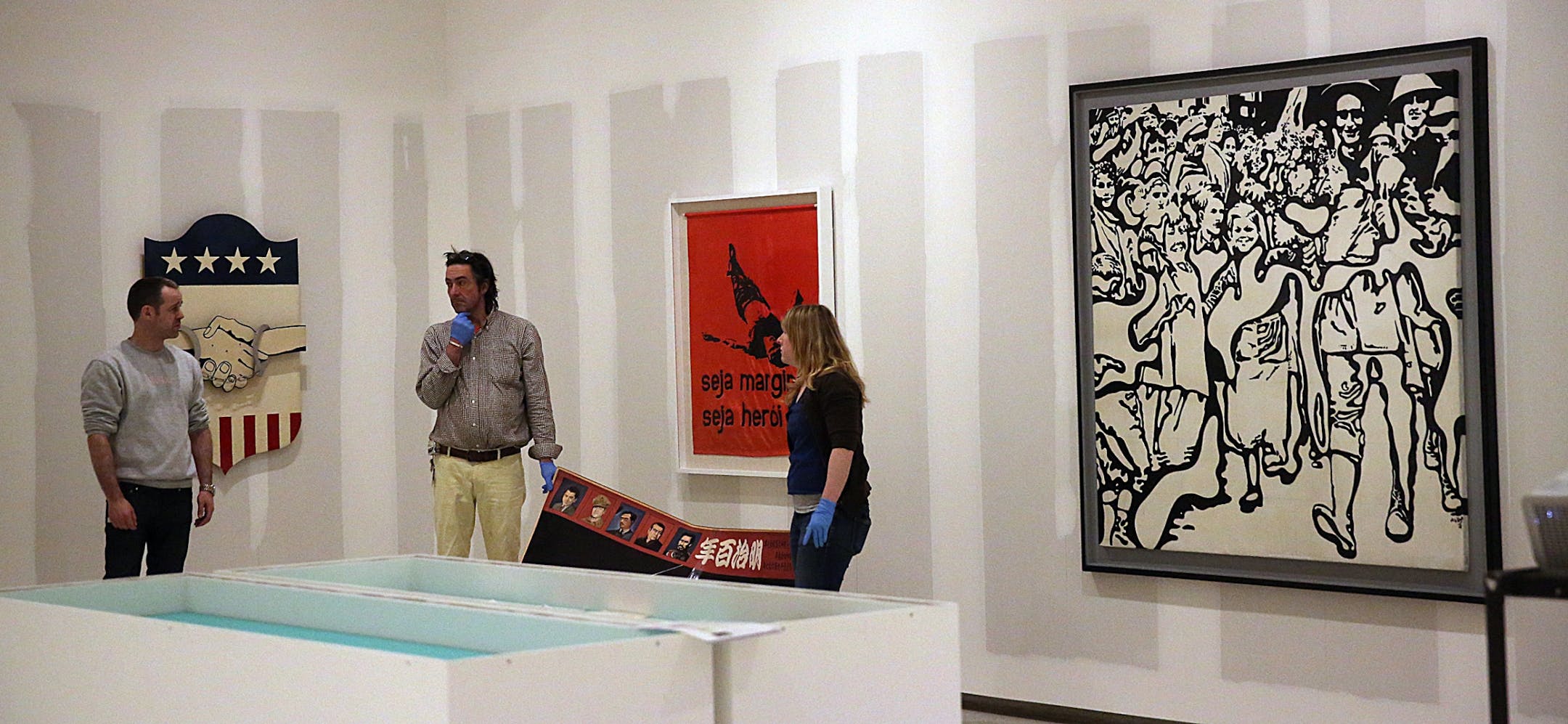 WAC curator Bart Ryan (left) monitored the installation process.