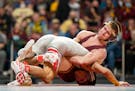 Gophers wrestler Patrick McKee (above at right) has outscored opponents 122-25 this season.