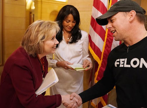 First Lady Gwen Walz greeted Randy Anderson, a board member with the Minnesota Second Chance Coalition.