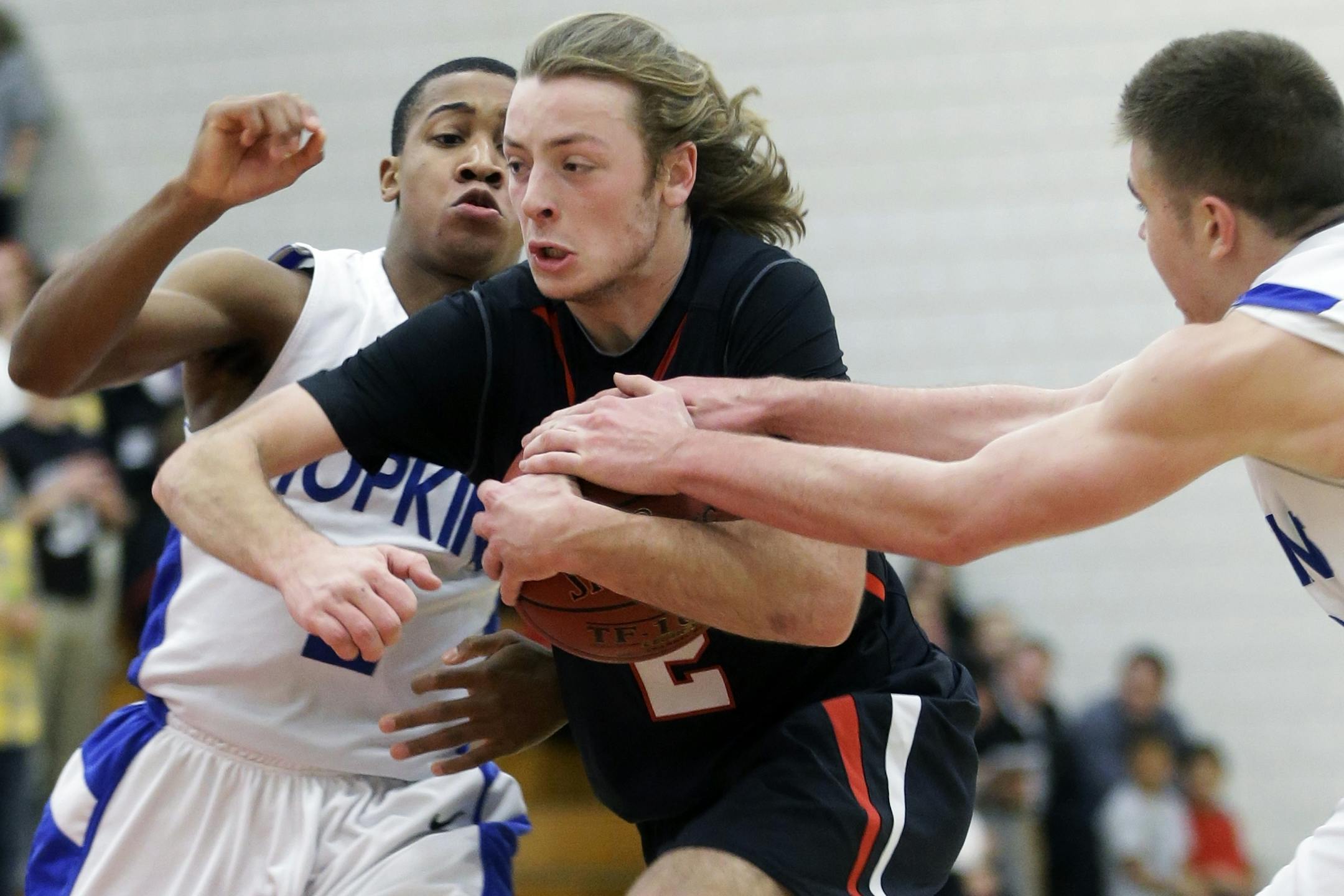 Kamali Chambers, left guards as Jacob Wright tries to steal the ball from Eden Prairie's Grant Sheffer.