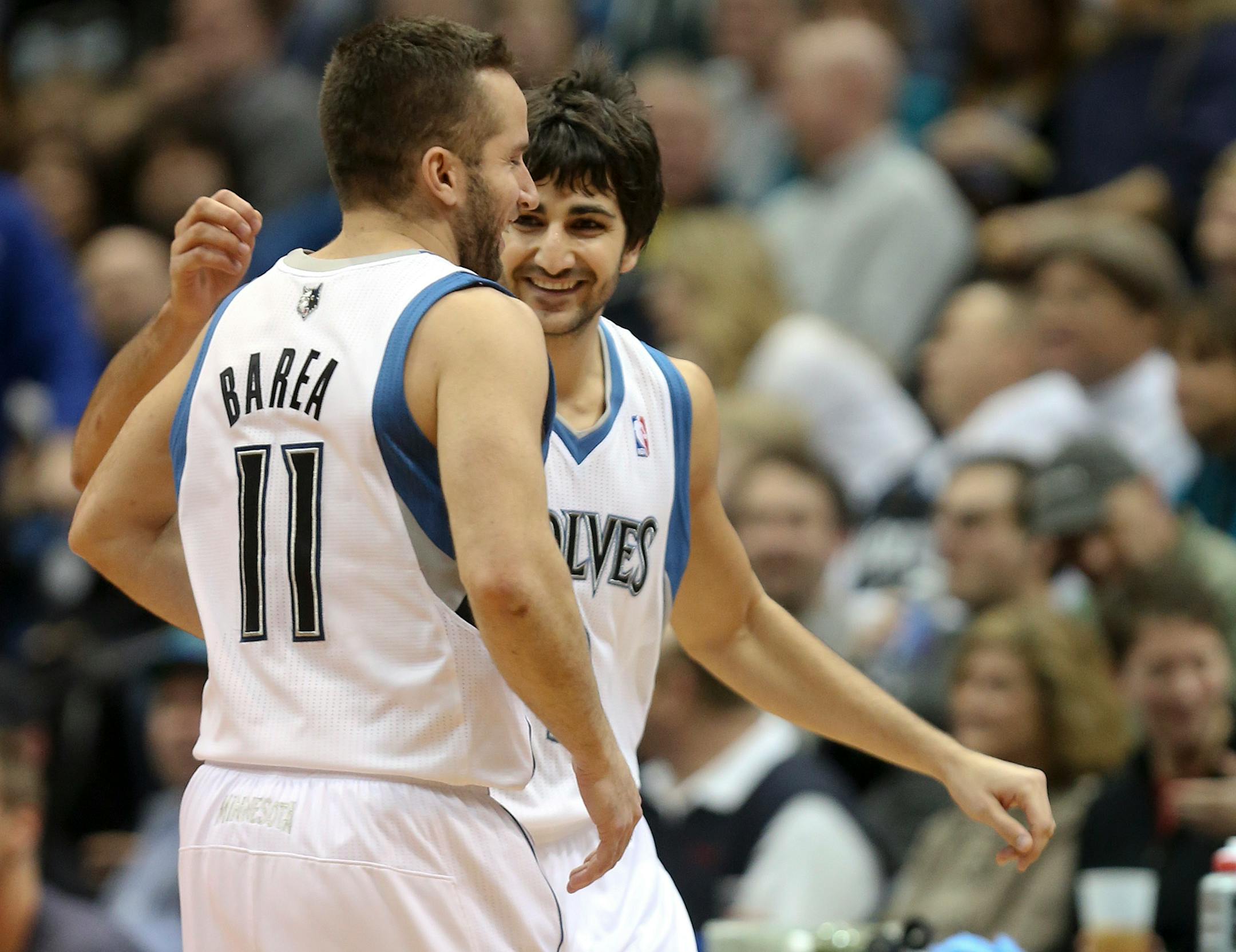 Ricky Rubio smiled with J.J. Barea during a timeout during first half action at Target Center in Minneapolis on Saturday December 15, 2012.