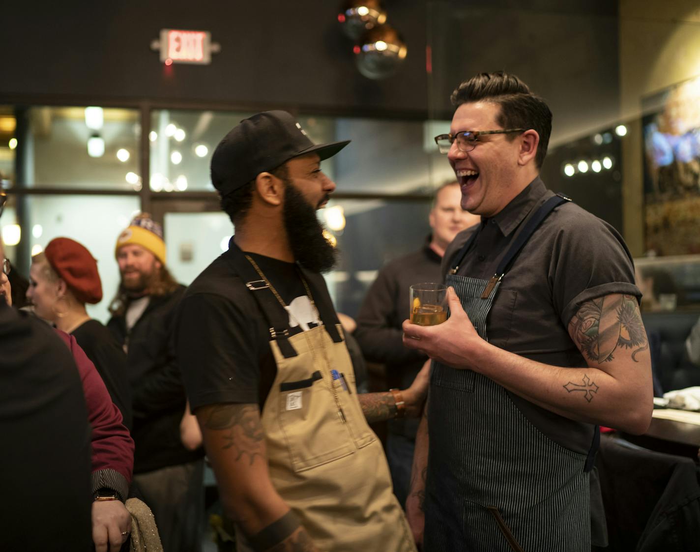 Justin Sutherland laughed with fellow Top Chef contestant Brian Young who can to St. Paul to help Sutherland host a six course meal at the Handsome Hog in St. Paul, Minn., on Thursday, January 17, 2019. ] RENEE JONES SCHNEIDER &#xa5; renee.jones@startribune.com The restaurant hosted a six course meal before a viewing party of Top Chef, a show that Sutherland is a contestant on.