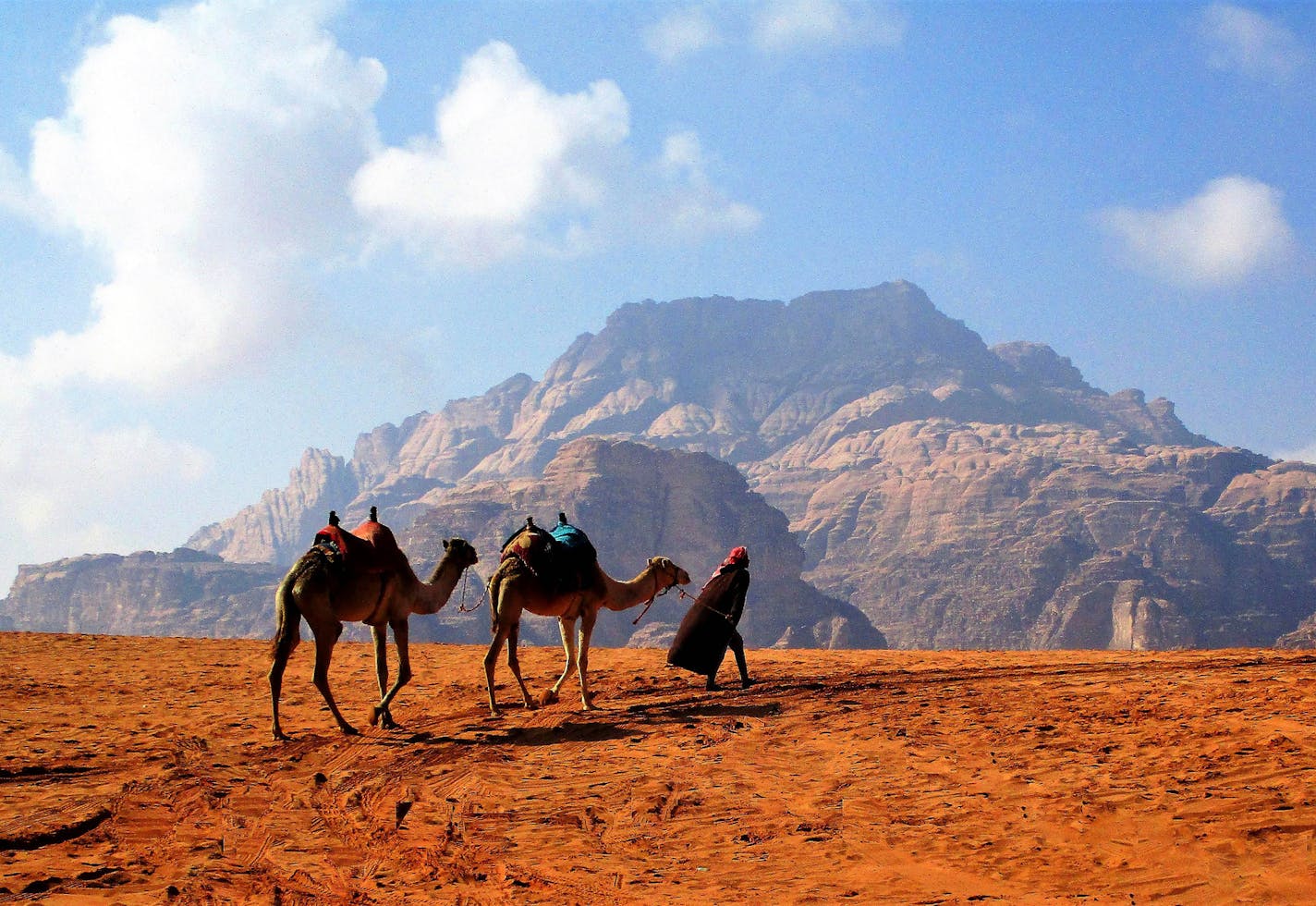 Use my name and location as submitted: Peter F Smith, Woodbury WADI RUM DESERT, JORDAN is a vast desert about 4 driving hours south of Amman mostly populated by the Bedouin tribes. Typically, a guide is recommended and is best arranged thru a tour of which we were a part. Wadi Rum Desert was used to film recent major movies owing to its unique scenery of both mountain and deserts as depicted in the photo. Our tour included holy land sites in Israel, parts of Palestine, and Jordan. Camera used: C