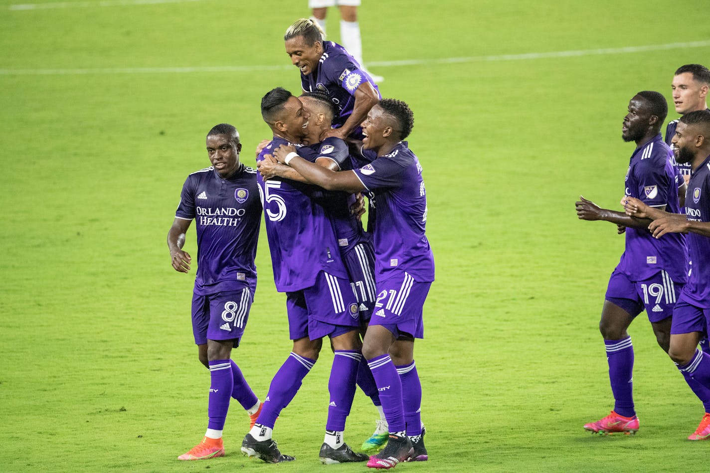 Orlando City midfielder Junior Urso (11) celebrates his goal against FC Cincinnati with teammates during an MLS soccer match Saturday, May 1, 2021, in Orlando, Fla. (Willie J. Allen Jr./Orlando Sentinel via AP)