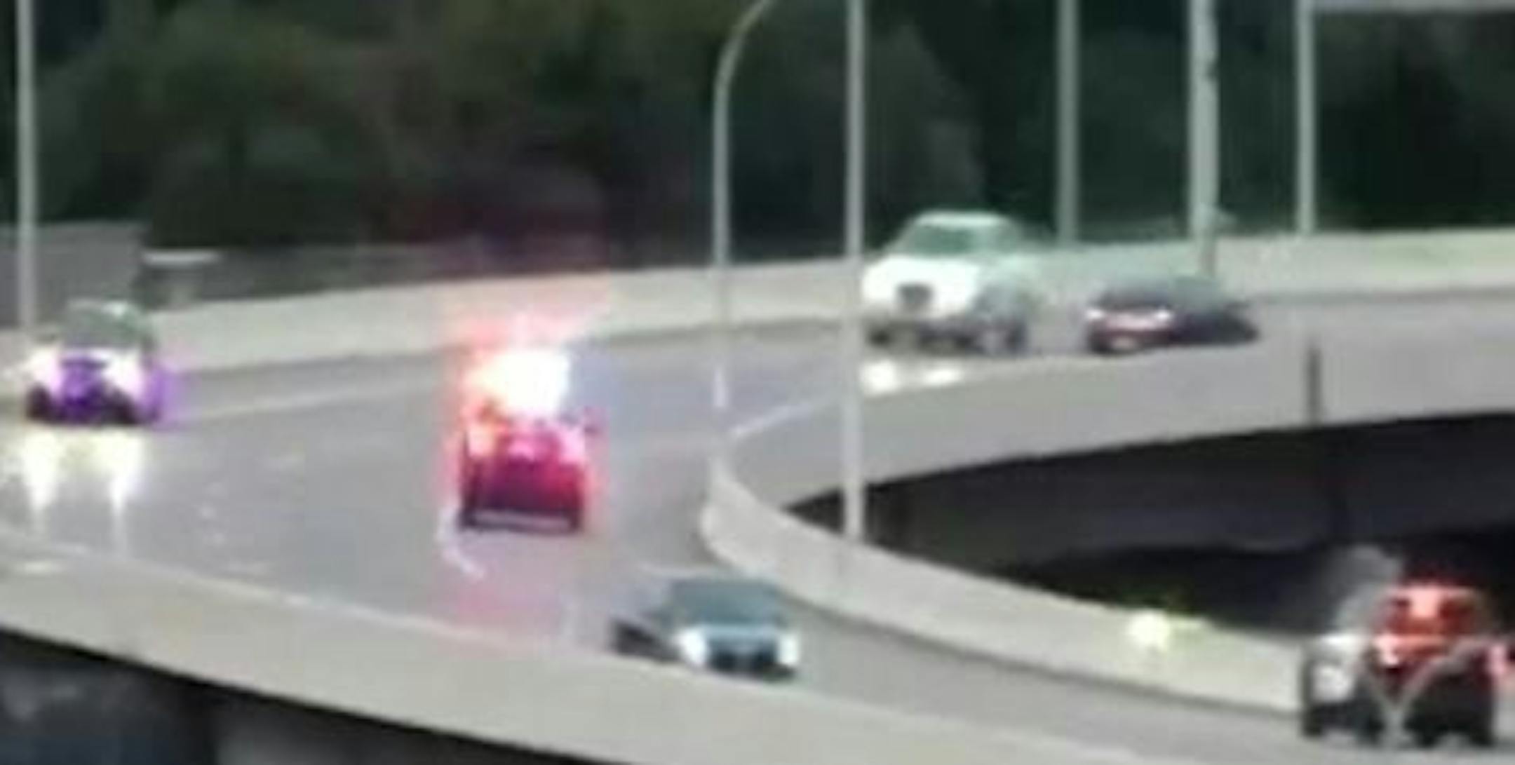 A homicide suspect in a dark car rounded the curve in the wrong direction on I-394 leaving downtown Minneapolis as two State Patrol squad cars gave chase.